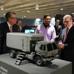 Keir Starmer with Peter Mandelson touring Palantir Technologies headquarters with company employees, in February 2025. In December 2025, Palantir won a three-year Ministry of Defence contract worth £240m. The contract, which is more than three times larger than any Palantir has previously won with the MoD, was awarded without tender.